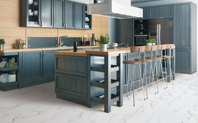 luxury vinyl tile flooring in kitchen with blue cabinetry.