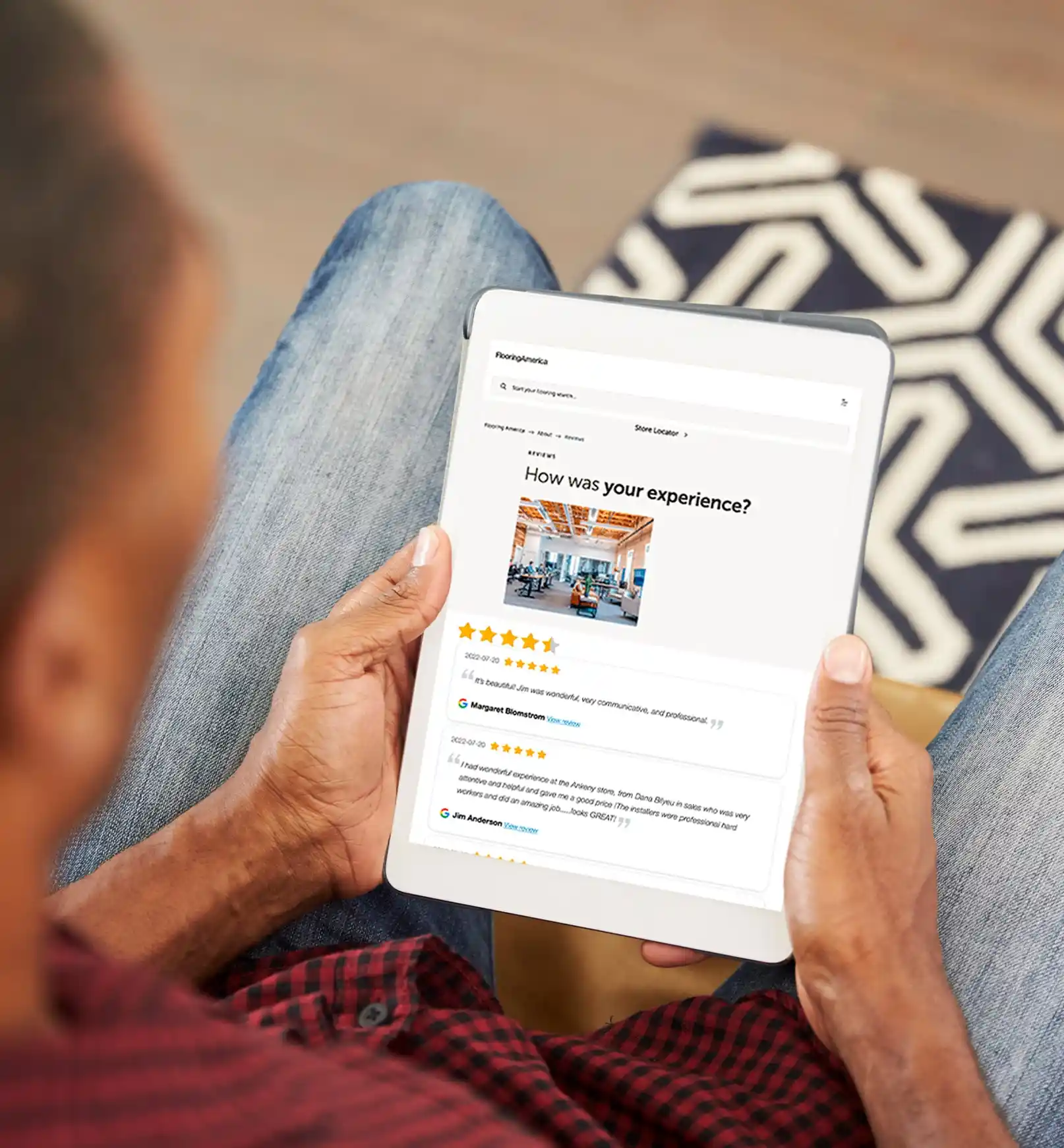 Man on tablet looking at reviews